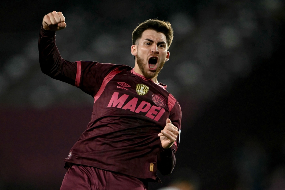 Lanus' midfielder #08 Franco Watson celebrates after scoring his team's first goal  