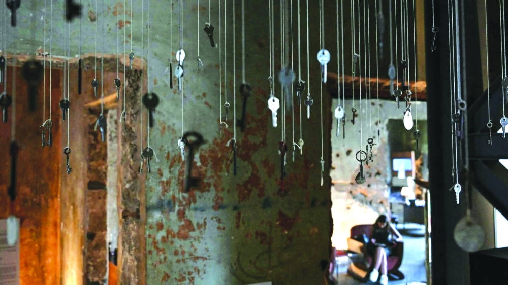 Keys of destroyed houses hang from the ceiling at "Hkeeli ya Jnoub" ("Tell me, O south") exposition, which aims to preserve the memory of villages destroyed by Israel, Beirut, Lebanon— AFP