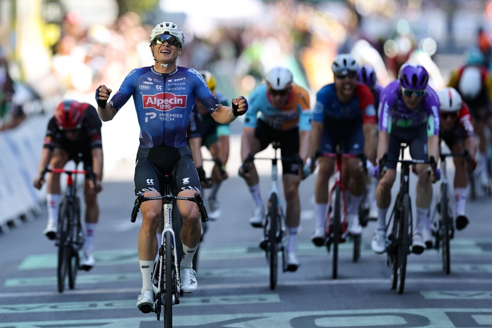 Philipsen past finish line to win 17th stage. — AFP