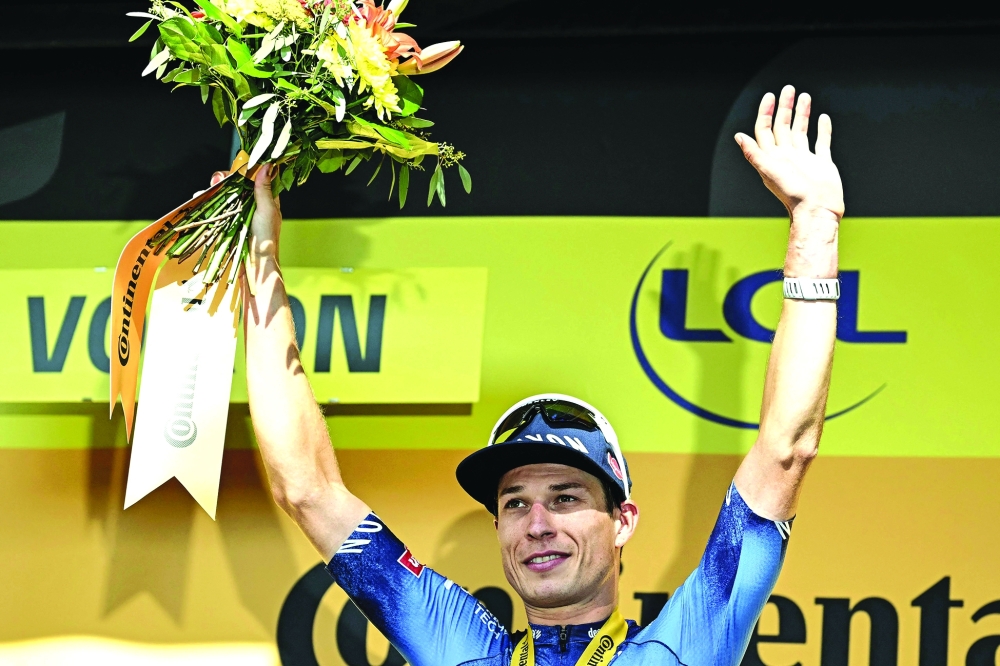 Jasper Philipsen celebrates on the podium. — AFP
