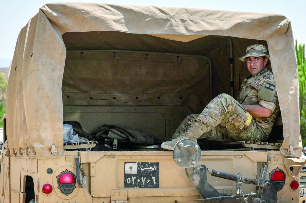 A member of the Lebanese army sits in a vehicle in Zawtar Al Gharbiya, following the withdrawal of Israeli forces under a US-brokered plan, in southern Lebanon. — Reuters