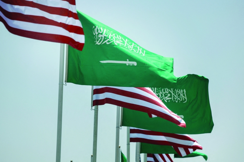 US and Saudi flags flutter along a highway in Riyadh, Saudi Arabia. — Reuters