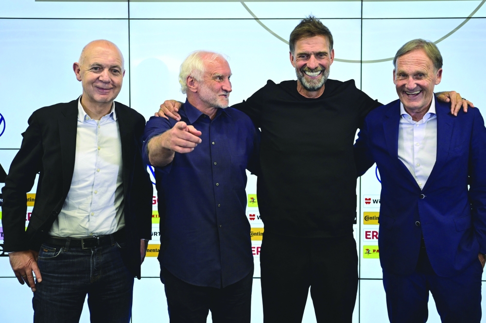 (From L) German Football Association (DFB) President Bernd Neuendorf, Director of Germany's national football team Rudi Voeller, Germany's newly appointed national football team head coach Juergen Klopp and the Vice-President of the German Football League (DFL) Hans-Joachim Watzke. — AFP