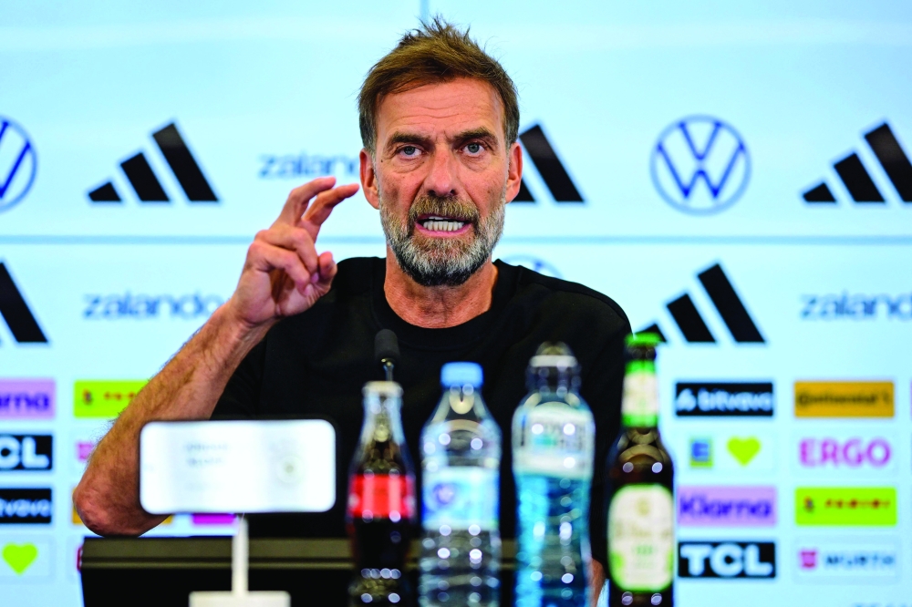 Newly appointed German coach Jurgen Klopp addresses a press conference. — AFP