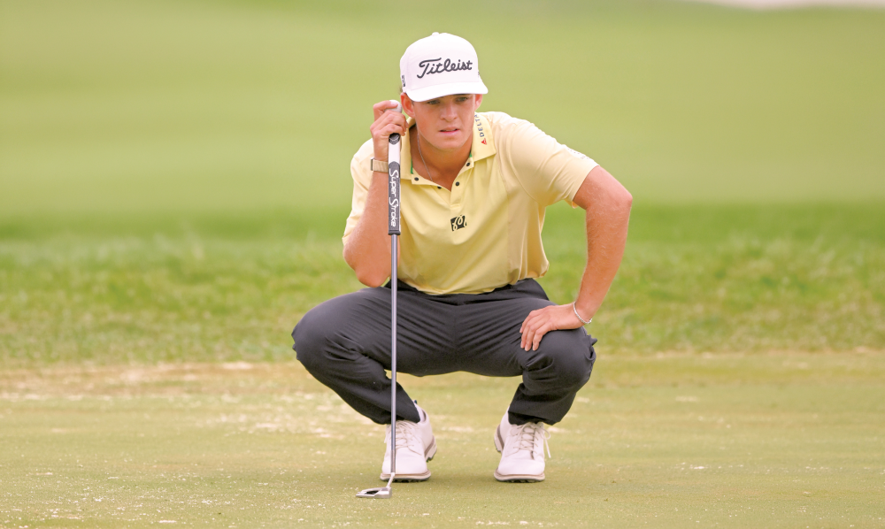Jackson Koivun reads the green on hole 7 during the third round of the 3M Open golf tournament at TPC Twin Cities. — Imagn Images.