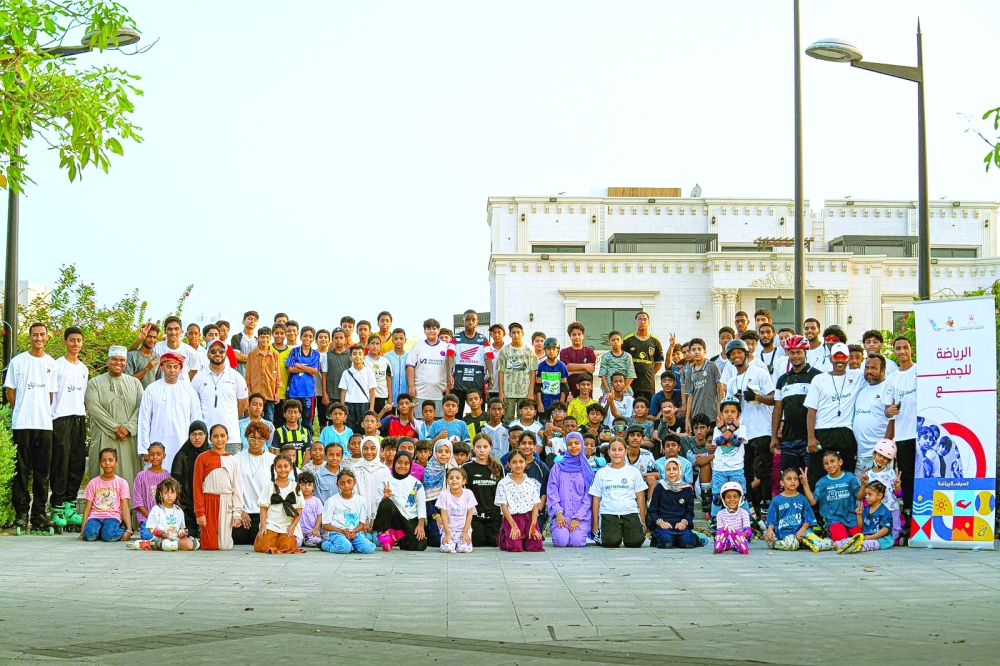 Group photo of the participants during the Roller Skating Open Day at Al Seeb corniche.