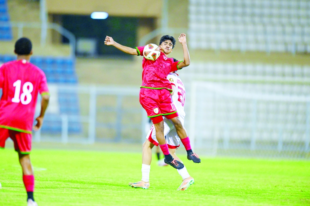 Oman and Bahrain players battle for possession during their second international friendly at the Royal Court Affairs Stadium. — Abdulwahid al Hamadani