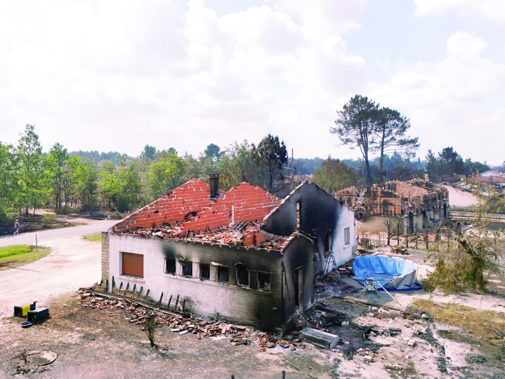 A drone view shows burnt houses in an area affected by wildfire, in Le Porge, Gironde, France. — Reuters 