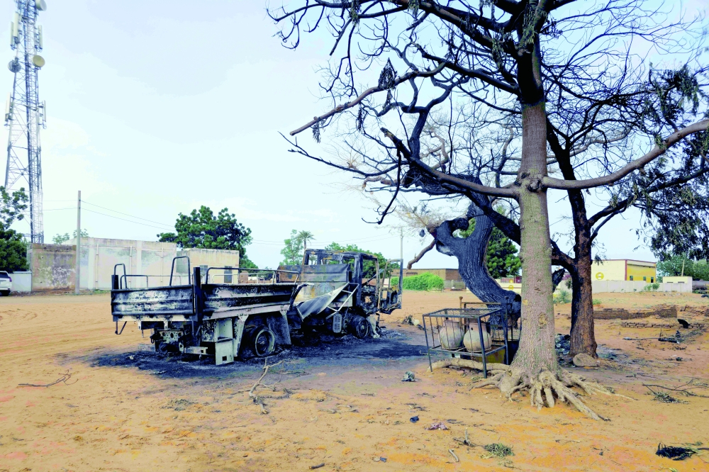 This picture shows a general view of the wreckage of a truck after the Rapid Support Forces targeted several civilian facilities in Al-Rahad Abu Dakna, one of the largest cities in North Kordofan State, located on the national highway linking Kosti and El Obeid, on July 25, 2026, according to government sources. The war between Sudan's regular army and the paramilitary Rapid Support Forces (RSF), that erupted in April 2023, has killed 200,000 people by some estimates and displaced upwards of 11 million. Several areas of Sudan have been plunged into hunger and famine. (Photo by AFP)
