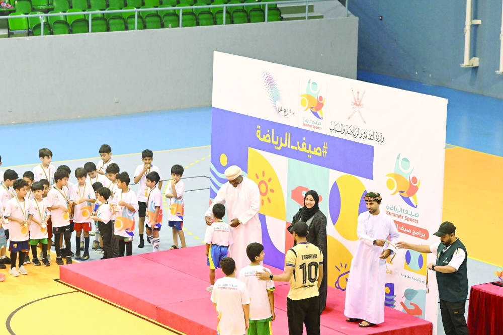 Officials honour the winners of the football and mini-games competitions