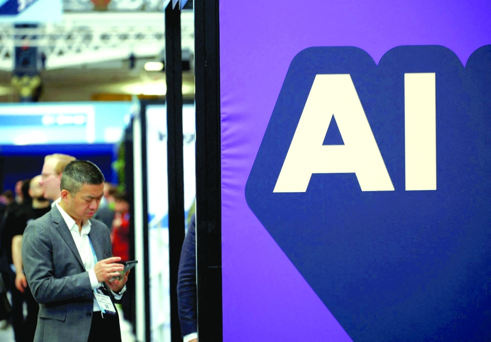 A banner shows message reading "AI" is displayed during the London Tech Week at Olympia, in London 