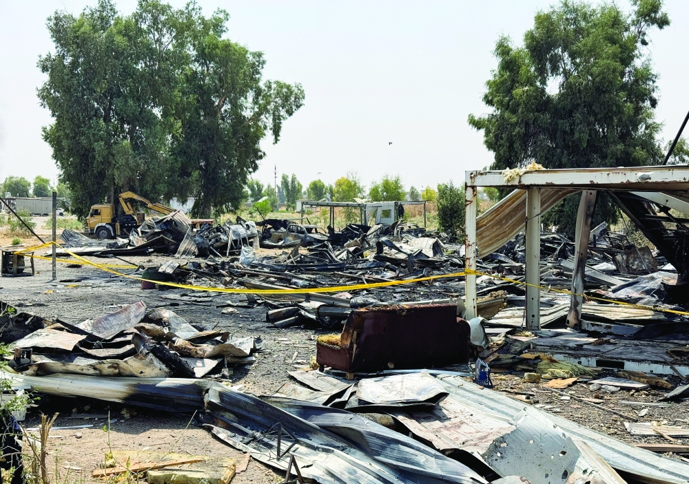 Damage at a site belonging to Iraq's Popular Mobilisation Forces (PMF) following air strikes in Bartella, Iraq 