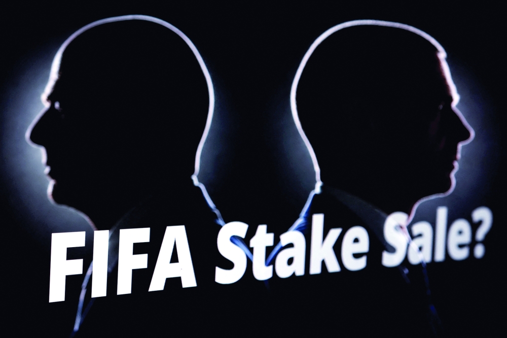 Silhouettes depicting Fifa President Gianni Infantino and UEFA President Aleksander Ceferin are seen next to text that reads "FIFA Stake Sale?. — Reuters 