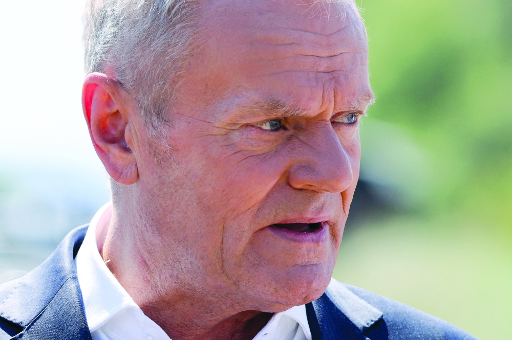 Polish Prime Minister Donald Tusk speaks to the press, near a crater in a field left by an unidentified object that appears to be a Russian missile, Polish Prime Minister Donald Tusk said on Thursday, near the village of Tarnawa-Kolonia in Lublin province, Poland, July 30, 2026. 