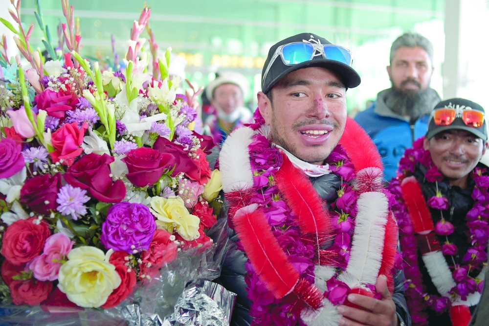 Nepal's climber Nirmal Purja, upon his arrival at the airport in Islamabad with his team after becoming the first to summit Pakistan's K2 mountain in winter. - AFP File