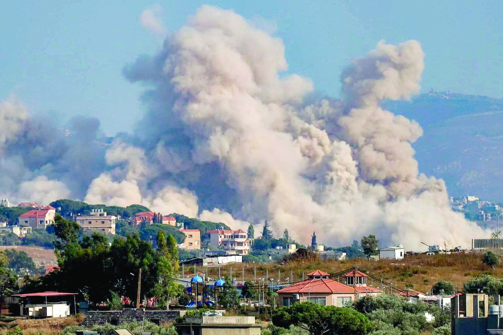 Smoke rises following an Israeli controlled-explosion on the village of Kfartibnit, southern Lebanon. — AFP