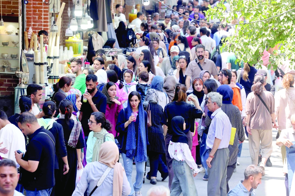 Iranians arrive to visit and shop at the Grand Bazaar in Tehran. — AFP