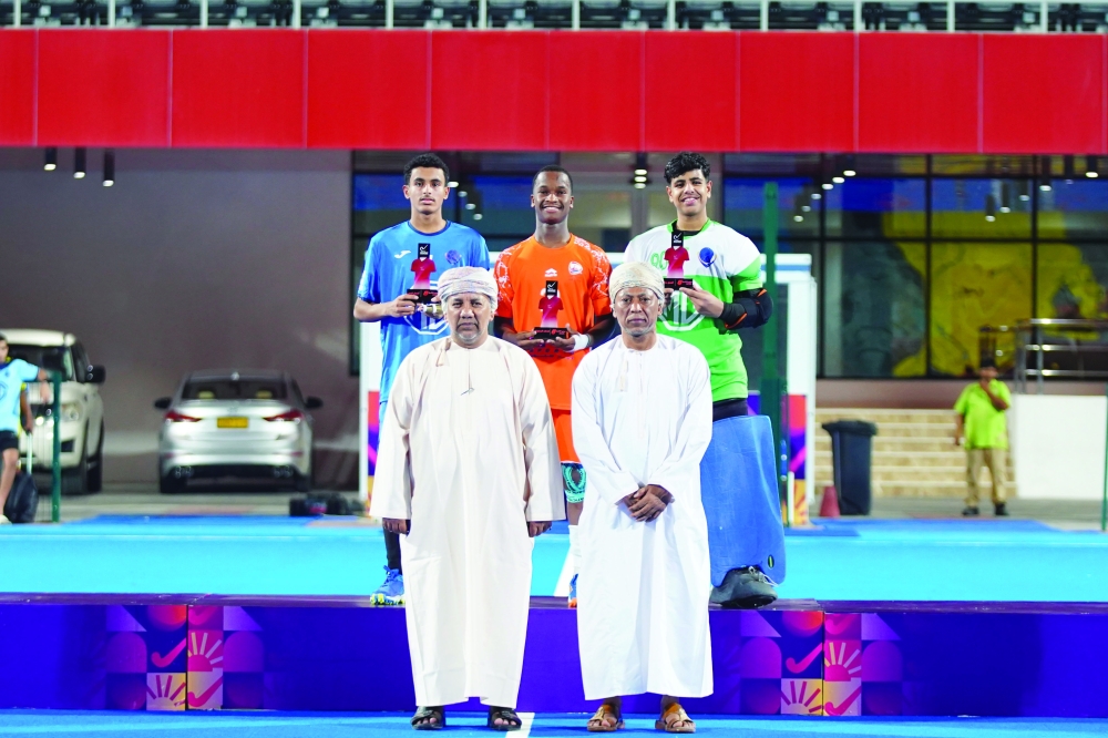 Individual award winners with officials during the closing ceremony of the Junior Hockey5s League.