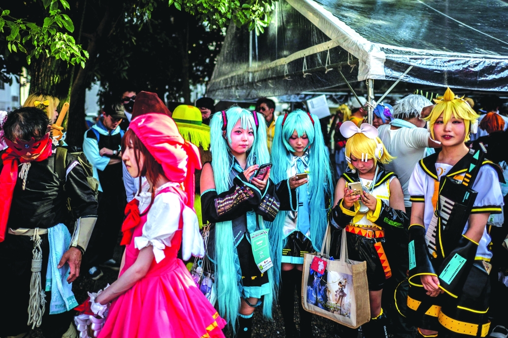 Cosplayers gather at the Osu Shopping Street before the Osu Cosplay Parade. — AFP