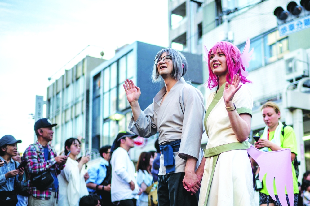 Cosplayers take part in the Osu Cosplay Parade. — AFP