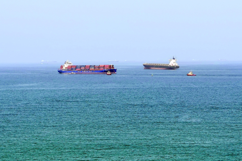 A cargo ship is pictured off the coast of the Khor Fakkan Container Terminal, the only natural deep-sea port in the region. - AFP