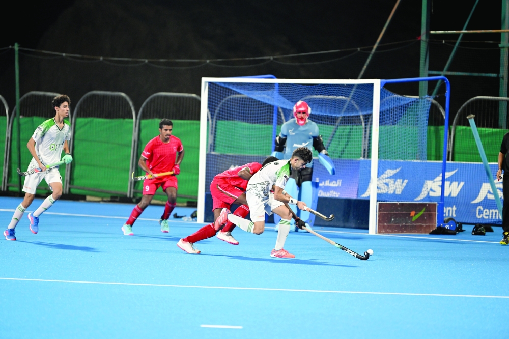Oman and Pakistan players in action during the series. — Abdulwahid al Hamadani