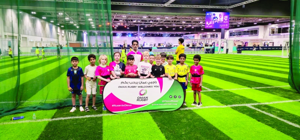 Children take part in a touch rugby training session as the sport makes its first appearance at Sports Spark.