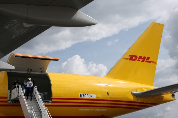 DHL cargo plane lands after mid-air collision with object