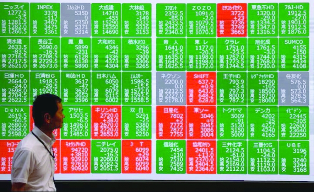 Asian shares fall as AI optimism fades; oil prices edge lower