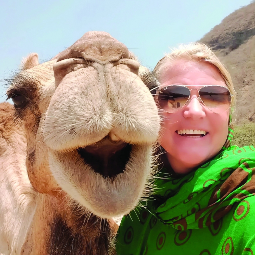 Carmen Storck gets up close and personal with a dromedary camel in the Dhofar hills