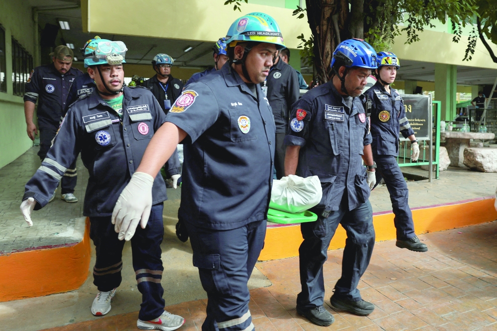 Emergency personnel at the Debsirin Nonthaburi School following the shooting incident at the school in Bang Kruai district in Nonthaburi province on the outskirts of Bangkok. — Reuters