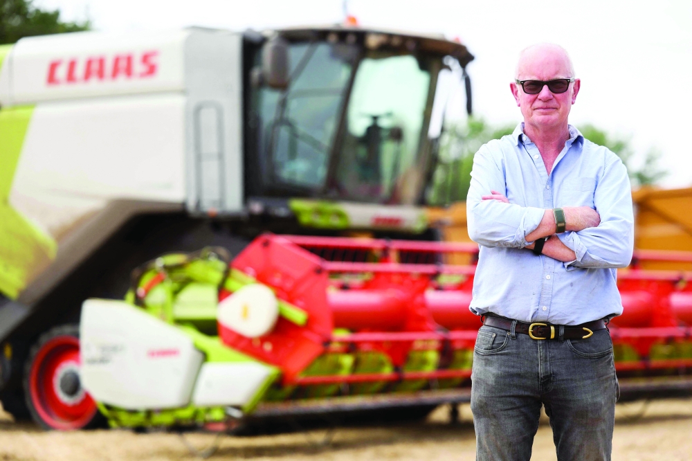 Farmer John Pawsey poses at Shimpling Park Farm in Bury St Edmunds, eastern England. — AFP