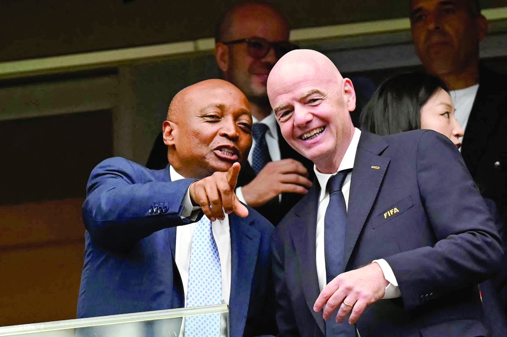 Confederation of African Football (CAF) President Patrice Motsepe (L) points out as he talks with Fifa President Gianni Infantino (R) ahead of the 2026 World Cup Round of 16 match between Canada and Morocco at the Houston Stadium on July 4. — AFP
