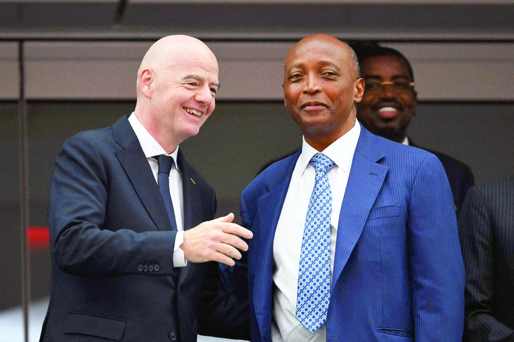 FIFA President Gianni Infantino (L) and Confederation of African Football (CAF) President Patrice Motsepe (R) talk ahead of the 2026 World Cup Round of 32 match between South Africa and Canada at the Los Angeles Stadium in Inglewood on June 28. — AFP
