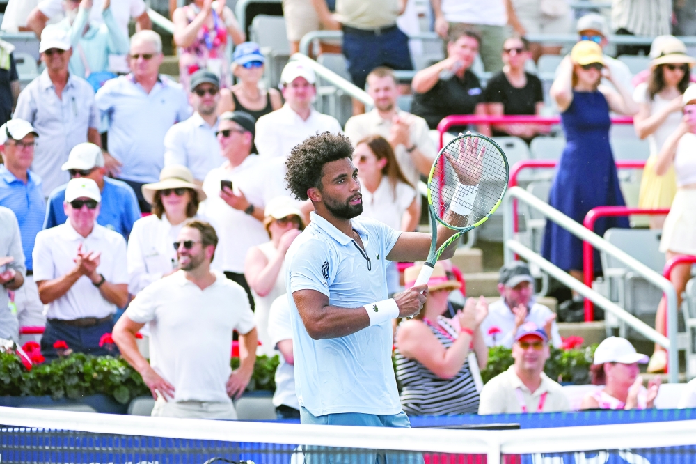 Arthur Fils (FRA) salutes the crowd after his win against Mariano Navone (ARG) in third round play at IGA Stadium. — Imagn Images