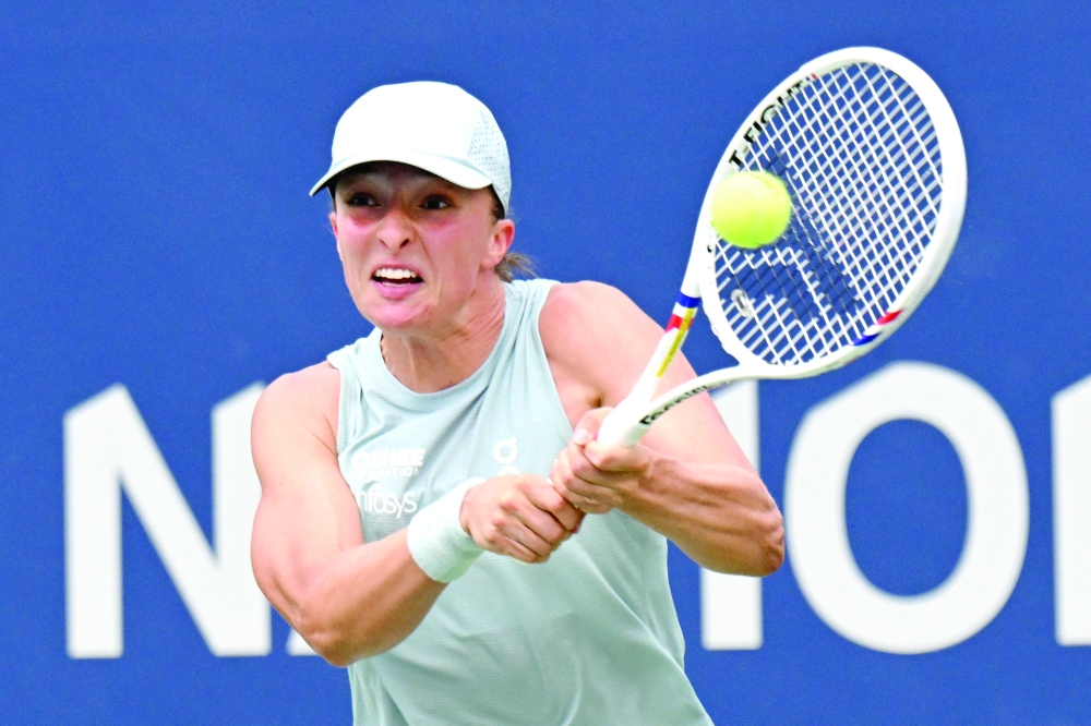 Iga Swiatek (POL) plays a shot against Viktorija Golubic (SUI) during fourth round play at Sobeys Stadium. — Imagn Images