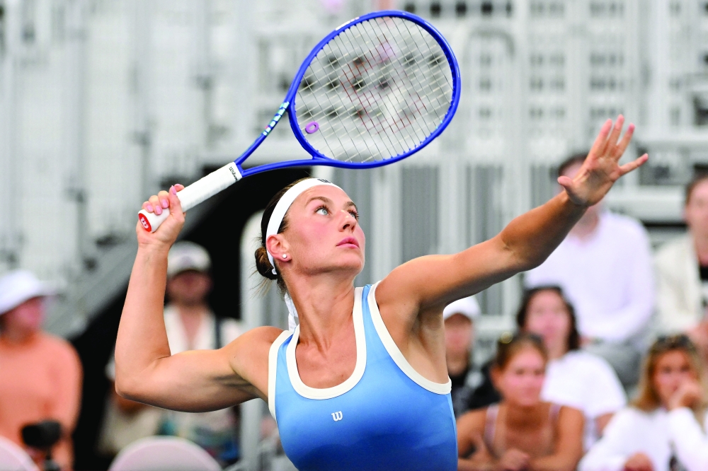 Marta Kostyuk (UKR) prepares to hit an overhead smash against Madison Keys (USA) during third round play at Sobeys Stadium. — Imagn Images