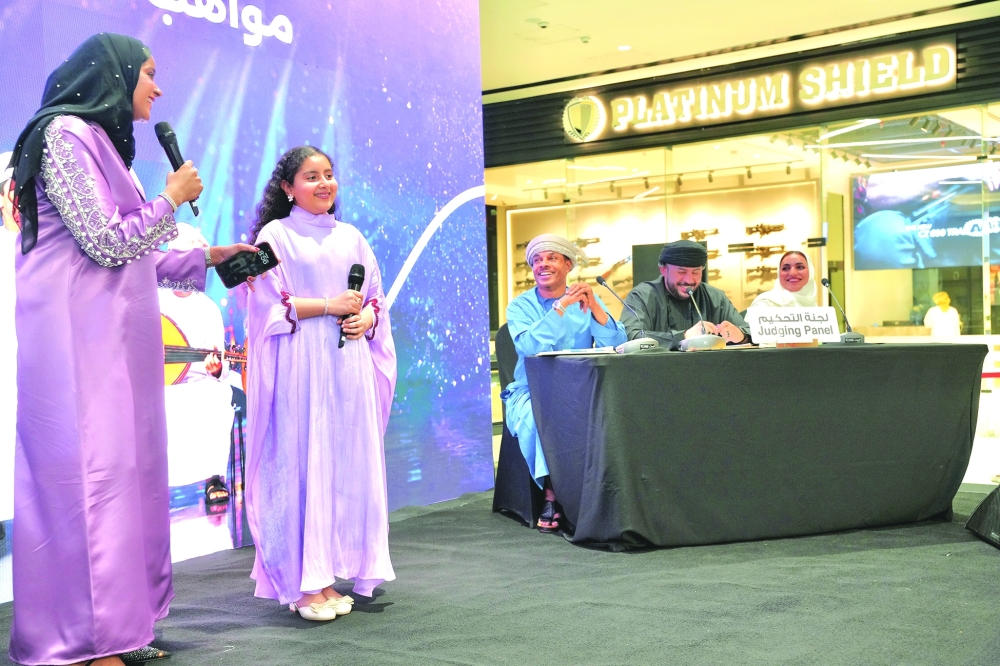 A young vocalist performs during the Explore Oman Talent Competition at Active Oman.