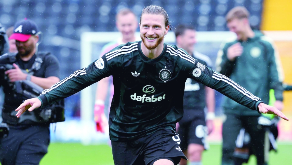 Kasper Hogh celebrates bagging a first-half treble during Celtic's 5-1 win over Kilmarnock.