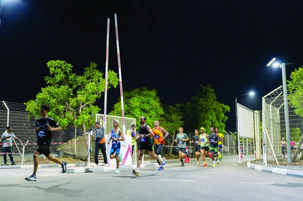 
Runners in action during the 5km race at the Muscat Night Run.