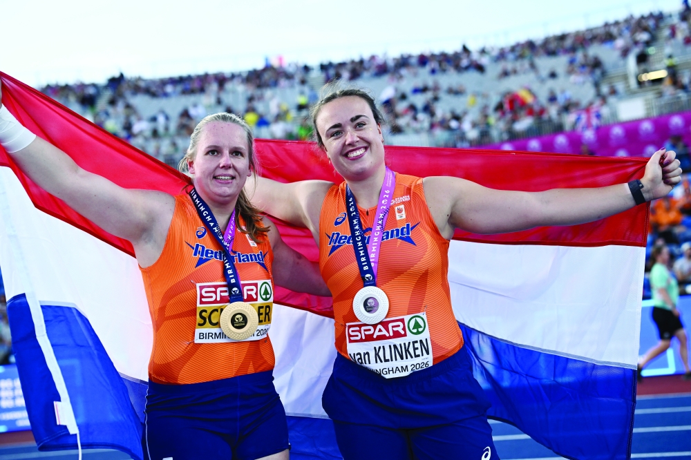 Gold medallist Netherlands' Jessica Schilder poses after winning the women's shot put final with silver medallist Netherlands' Jorinde van Klinken REUTERS