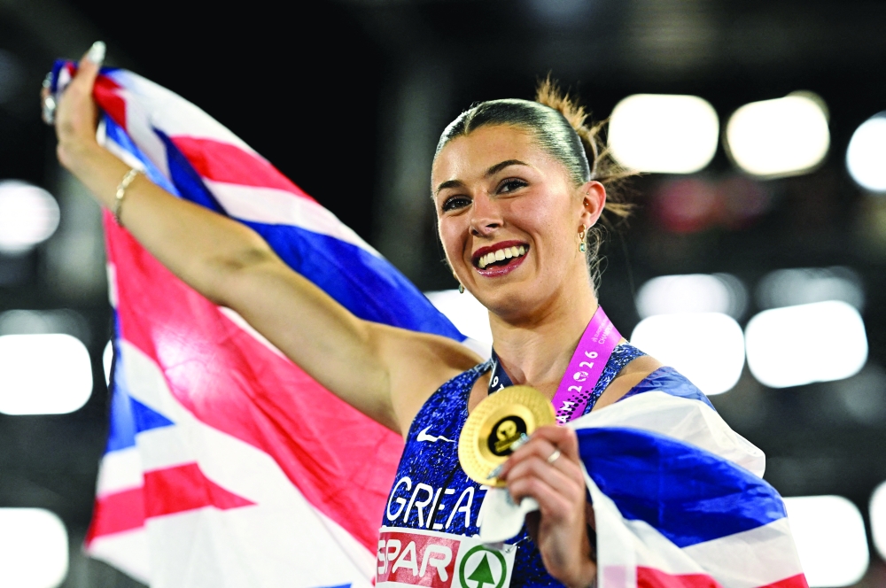 Gold medallist Great Britain's Amy Hunt celebrates after winning the women's 100m final REUTERS