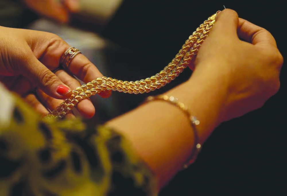 Gold retreats from two-month peak as traders await PPI.