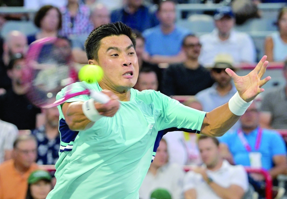 Brandon Nakashima (USA) hits a forehand against Rafael Jodar (ESP) during their semifinal at IGA Stadium. — Imagn Images