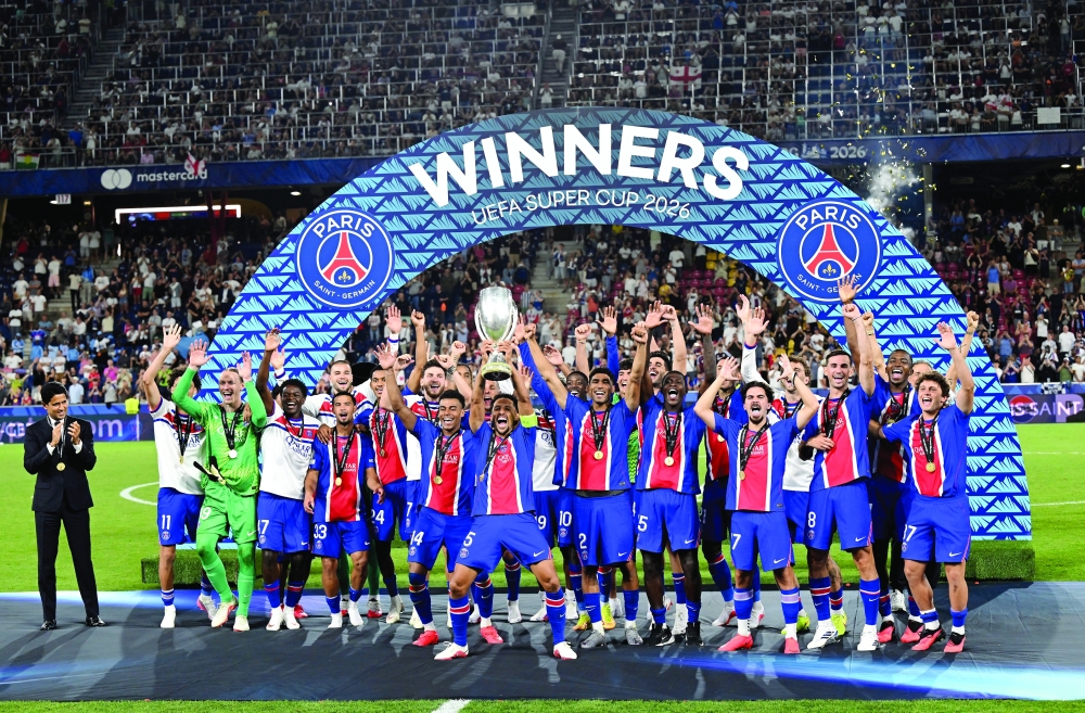 Paris St Germain's Marquinhos lifts the trophy with teammates after winning the UEFA Super Cup REUTERS