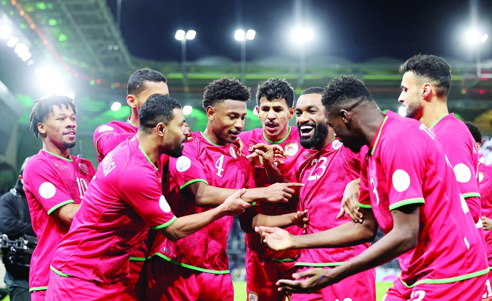 Oman's Arshad al Alawi celebrates scoring their first goal with teammates during the semifinal against Saudi Arabia in the 26th Gulf Cup 2024 in Kuwait City. — Reuters