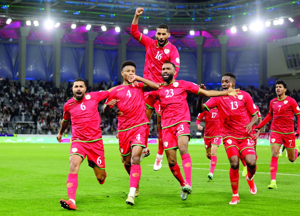 Oman's Arshad al Alawi celebrates scoring their first goal with team-mates during the semifinal against Saudi Arabia in the 26th Gulf Cup 2024 in Kuwait City. — Reuters