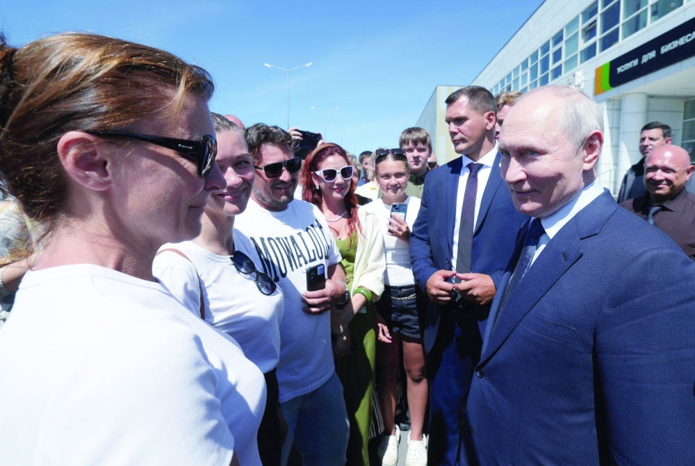 Russian President Vladimir Putin meets residents as he visits the Southern Kuril Island of Iturup. - Reuters
