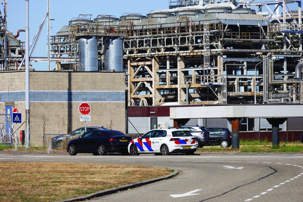 A police car outside a facility for petroleum products, following an explosion, at the port of Rotterdam, Netherlands. — Reuters
