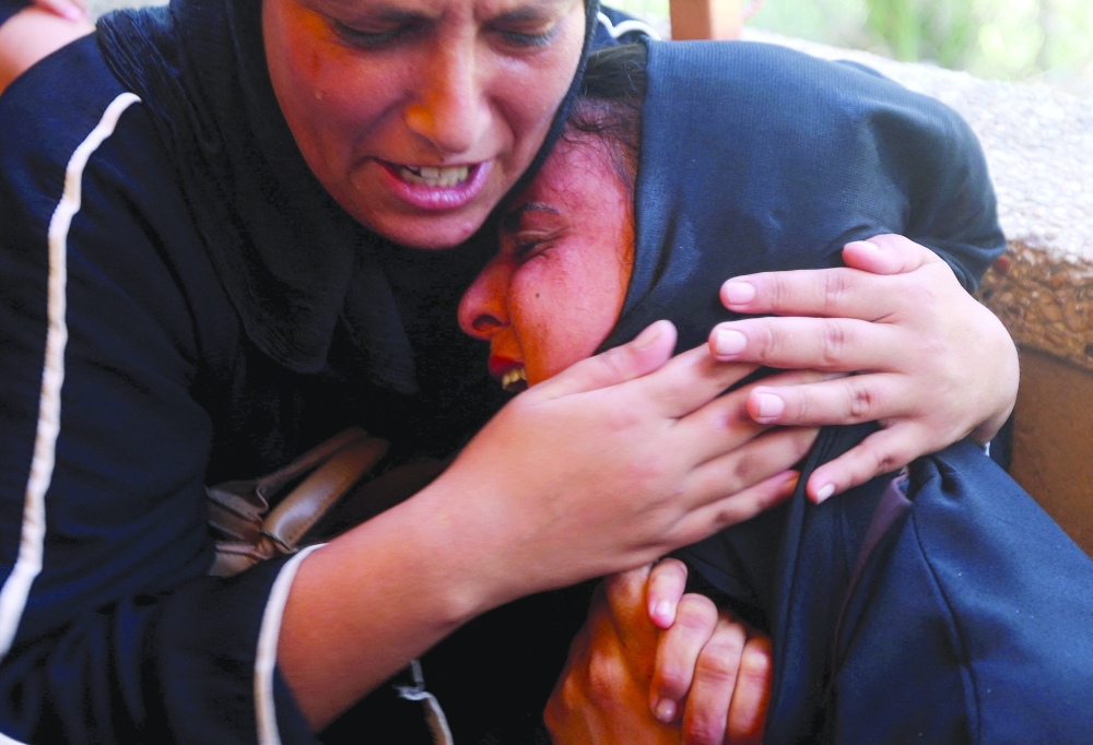Mourners react at the funeral of a Palestinian man, Huthaifa Kawari, who was killed in an Israeli strike, according to medics, at Nasser Hospital in Khan Yunis in the southern Gaza Strip. - Reuters